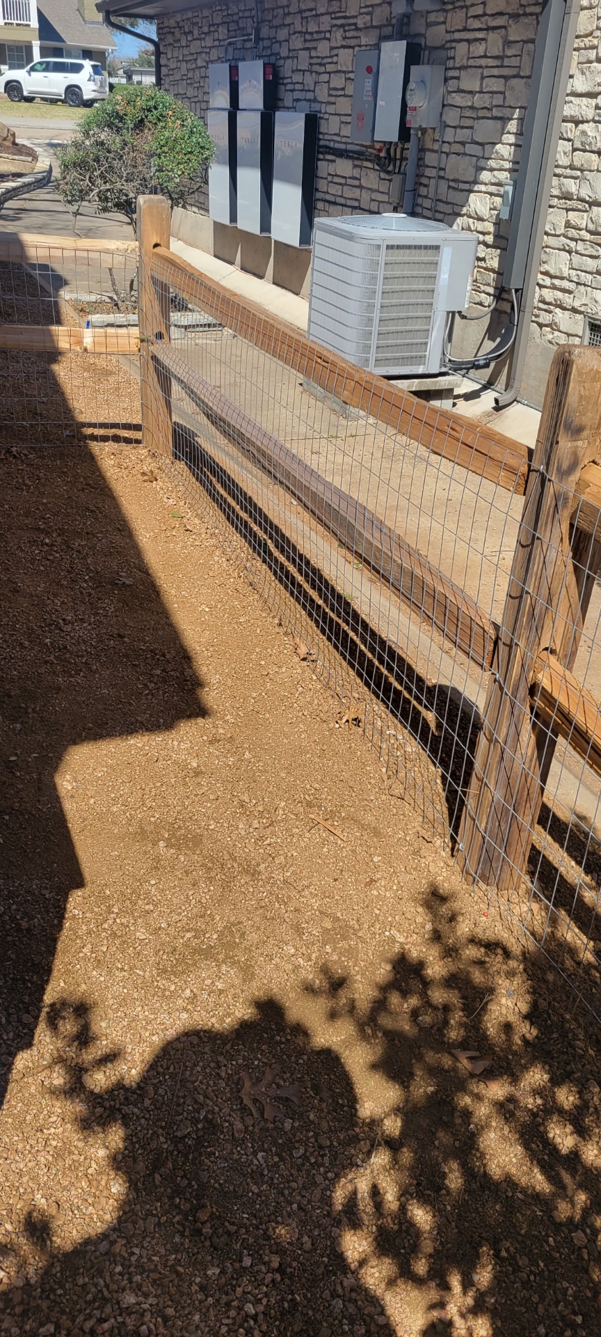 Wood-rail and wire field fence installed along a rural Hood County property line