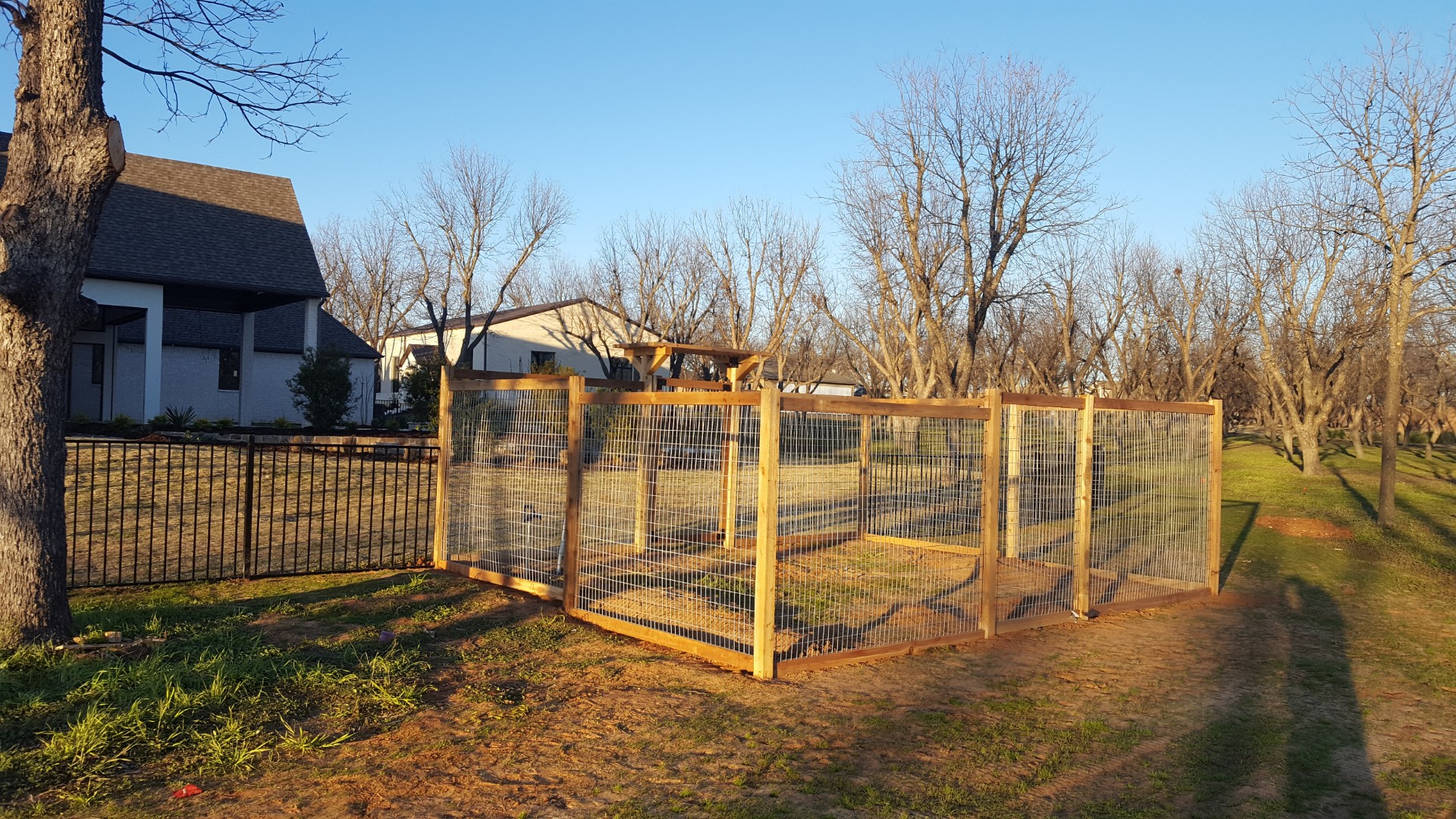 Cedar-framed field wire fence and gate built near a Hood County home and pecan orchard