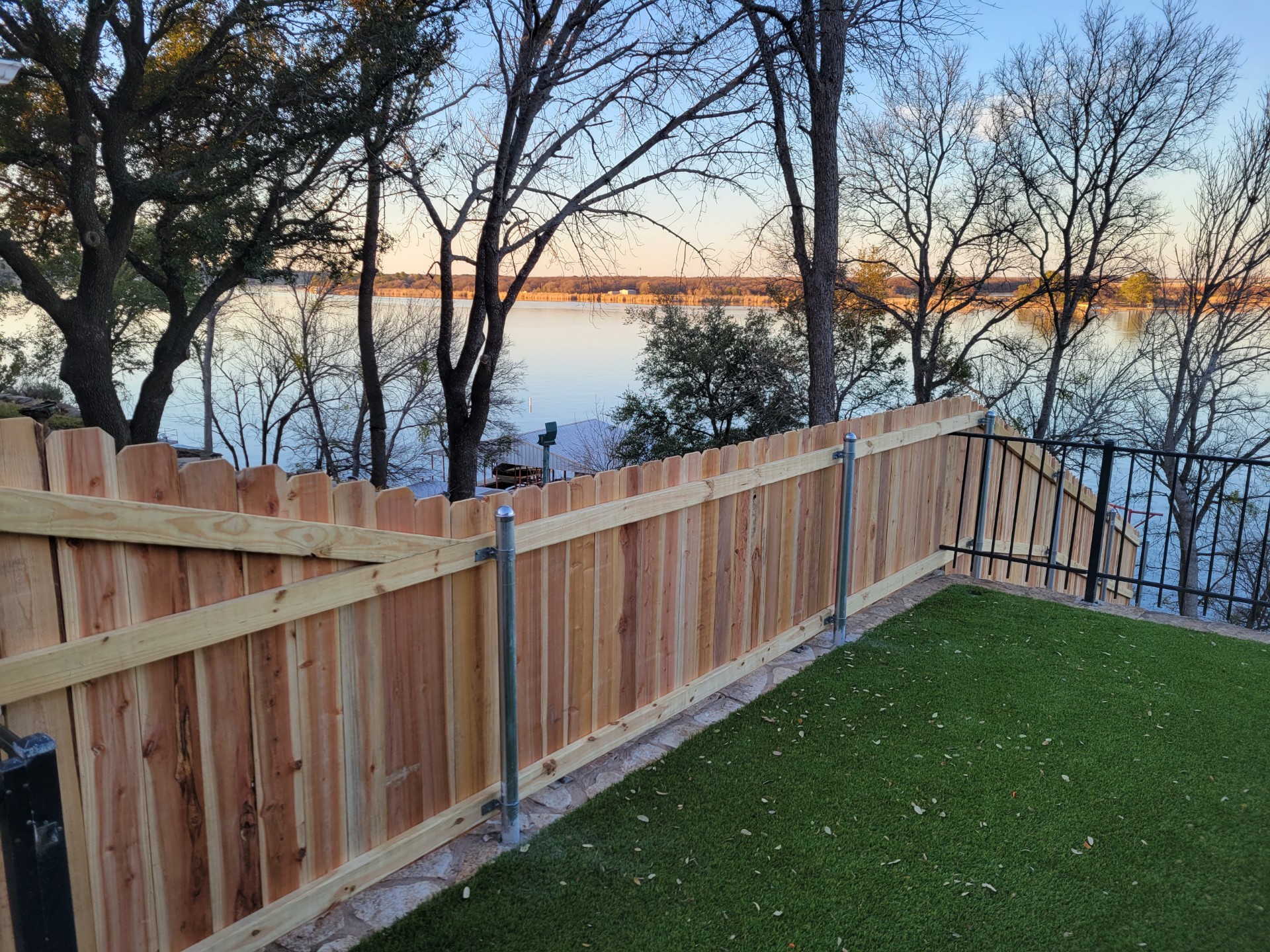 New cedar privacy fence installed on a Lake Granbury-area property